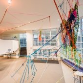 A view from the ceiling looking north of a yarn and fabric installation.