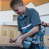 Young student doing a paperclip a experiment with Mind Trekkers.