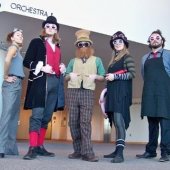 Members of Bonkers Toy and Coffee Shop dressed in Alice in Wonderland costumes.