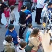 Overhead view of Bonkers serving tea to guests.