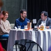 People enjoying food and a show