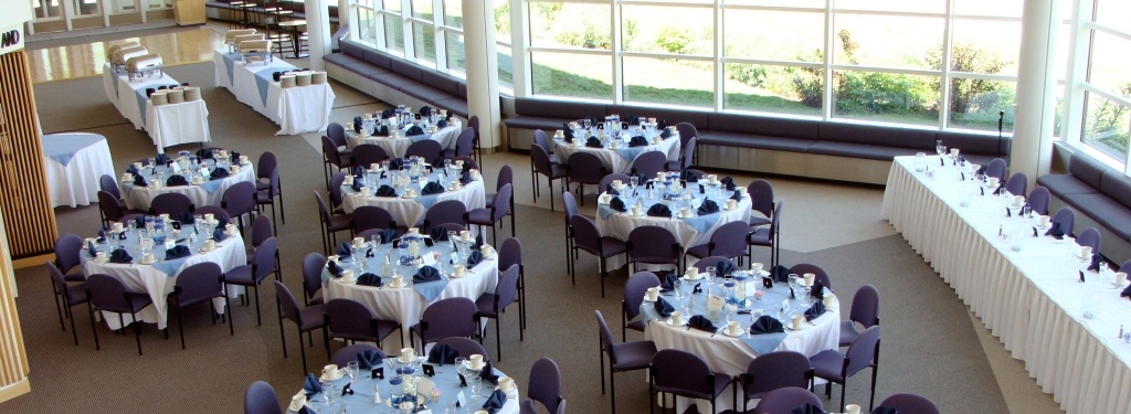 Horner Lobby set up for a wedding receiption with sitting tables, chairs, place settings, and buffet tables.