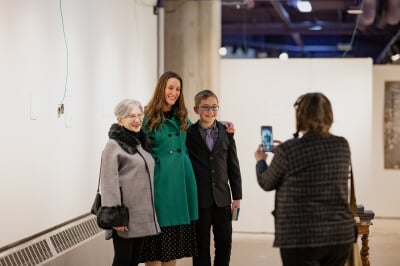 guests in the rozsa art galleries posing for a photo together