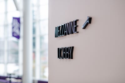 photo the sign in the rozsa lobby that has an arrow to the mezzanine