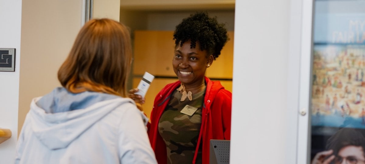 A ticket buyer talks with box office staff