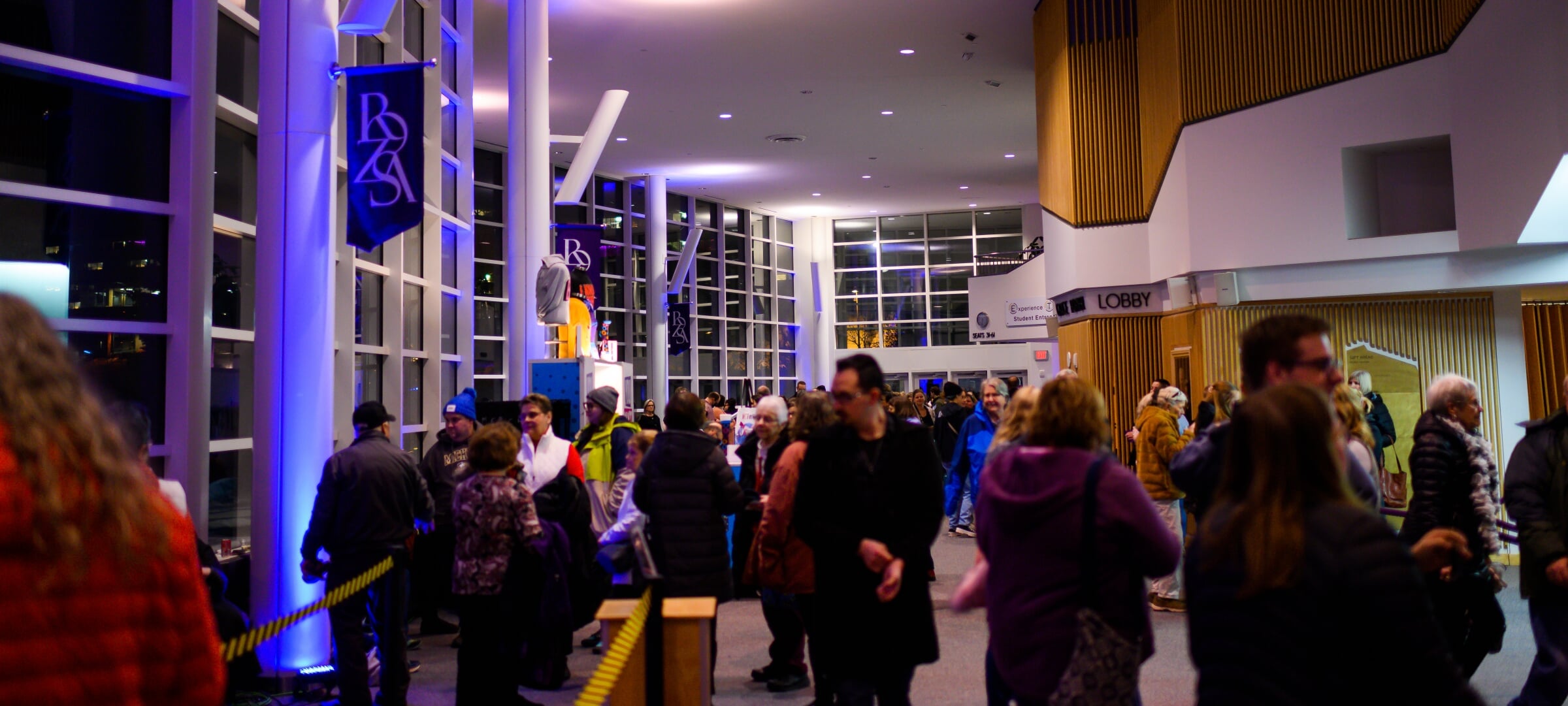 Rozsa guests in the Lobby before a performance at night