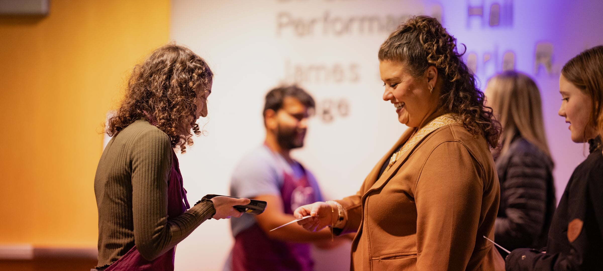 Rozsa usher scans guest ticket at a theatre performance