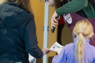 Rozsa volunteer usher scanning in a audience member's pdf ticket