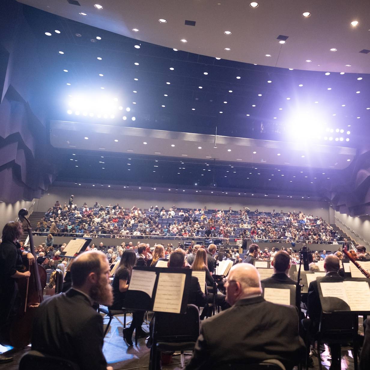 The Keweenaw Symphony Orchestra looks over the audience in the Rozsa Center auditorium