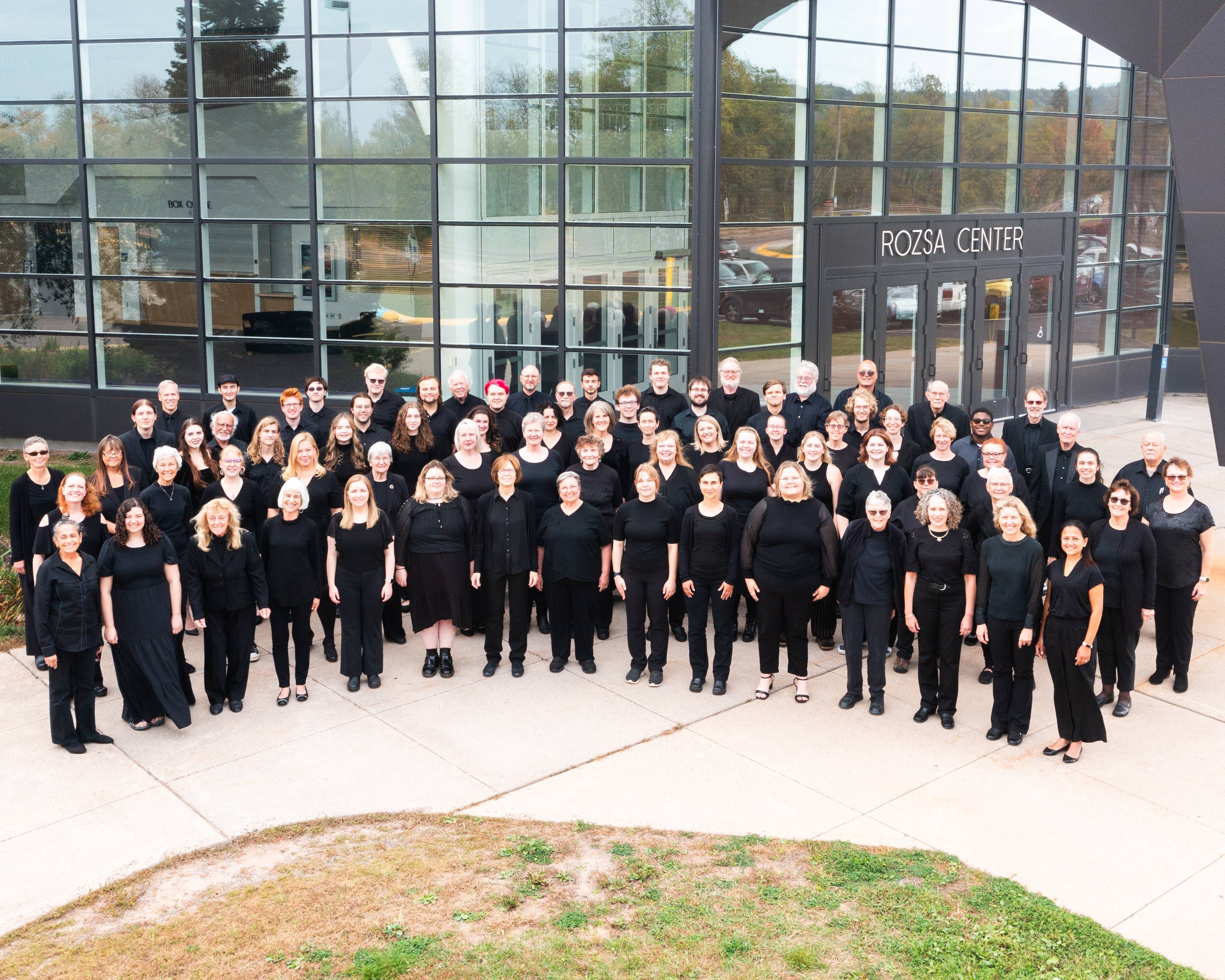 Michigan Tech Concert Choir poses in front of the Rozsa Center