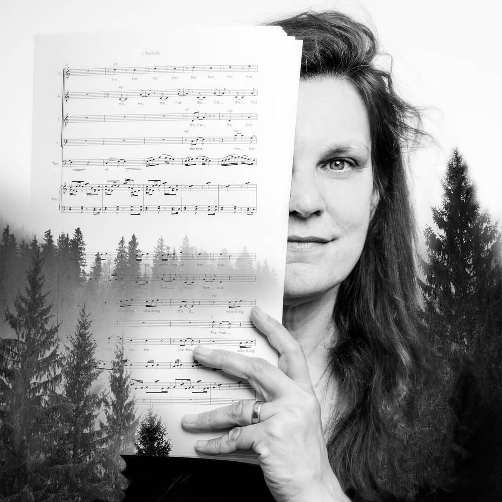 A stylized photo of Libby Meyer with music covering the right half of her face. An image of pine trees is layered over the image.