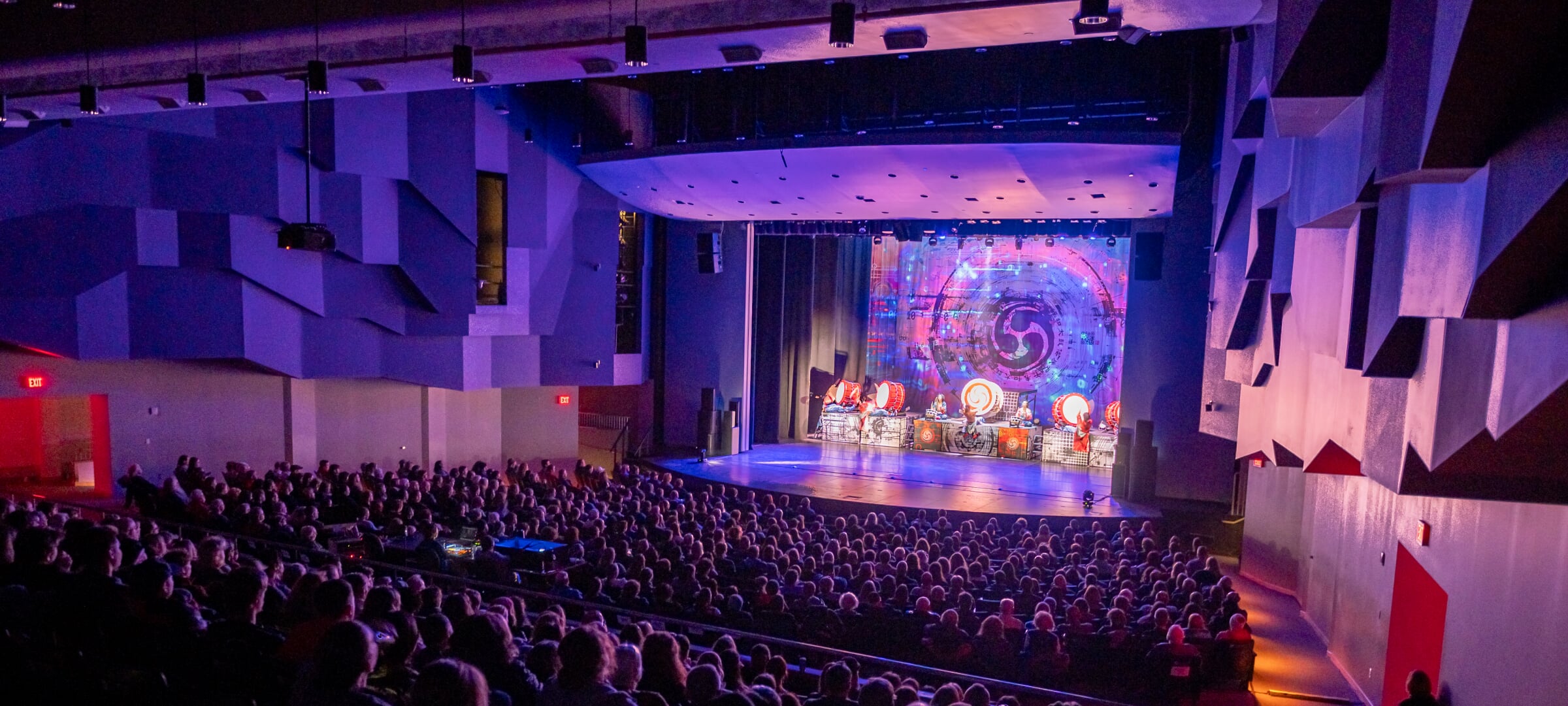 Inside of the Rozsa theatre with a full audience with Yamato on stage