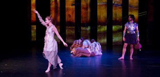 Student performers on stage in costume