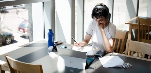 Student studying in the J. Robert Van Pelt and John and Ruanne Opie Library.