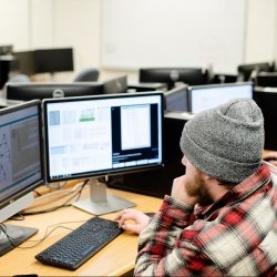 Student sitting at a computer in a lab