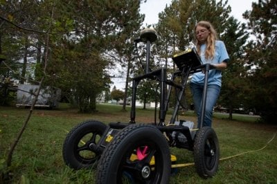 Michigan Tech student using ground penetrating radar