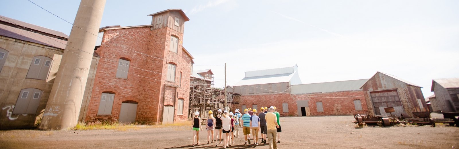 Quincy Smelter with a group walking in