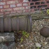 Muzzle loading rusted cannon with a cannonball