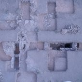 Squares dug into earth showing ruins underneath