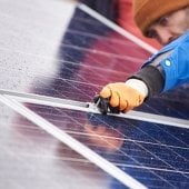 Worker on a solar panel