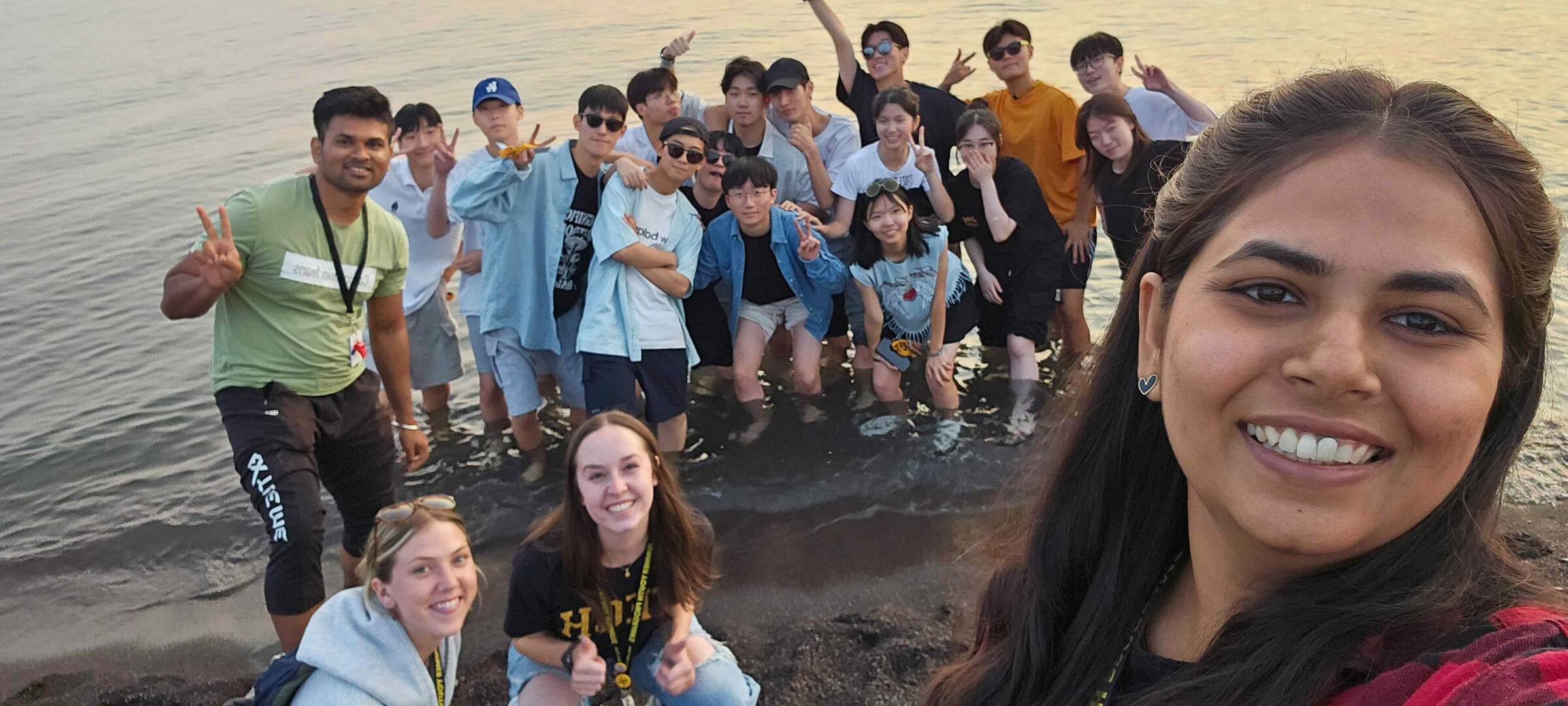 Study Abroad Students posing in the water.