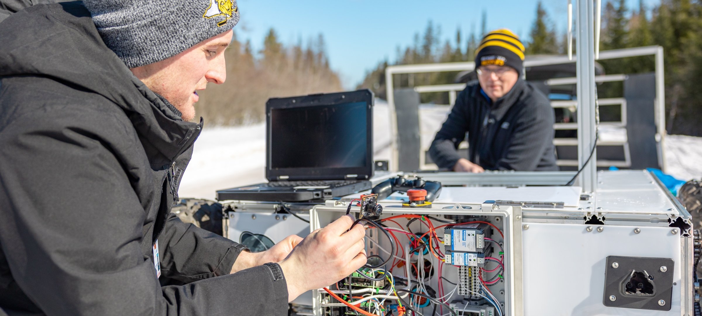 Students using technology in the snow