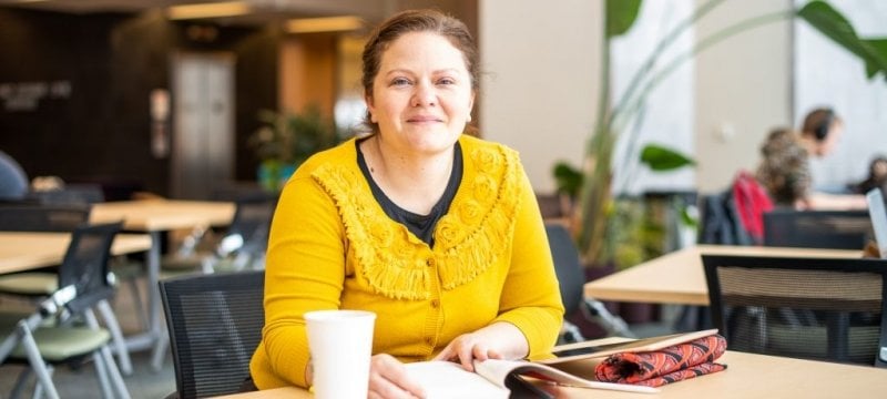 Jennifer Rachels sitting in the Library.