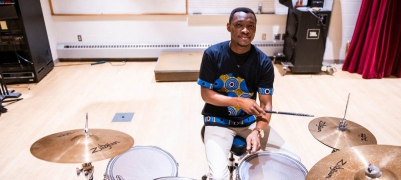 Adewale Adesanya playing the drums.