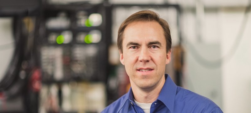 Brad King standing for a portrait.