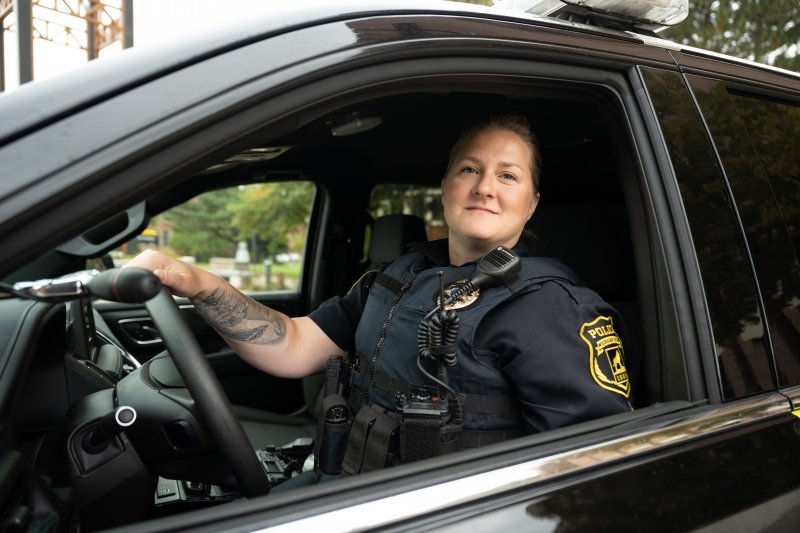 Michigan Tech police sgt. Beth Maata in her patrol car on campus