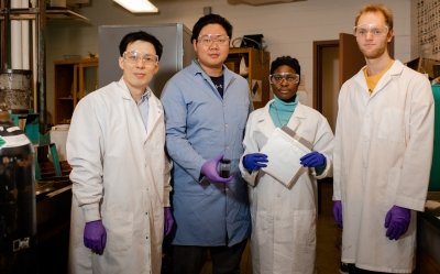 A researcher and four Michigan Tech students in Lei Pan's lab where they study lithium-ion battery recycling. The student second from left is commencement speaker.