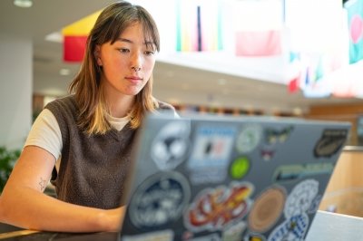 An Obama-Chesky Voyager scholar at Michigan Tech working on her computer in the College of Forest Resources and Environmental Sciences at Michigan Tech.