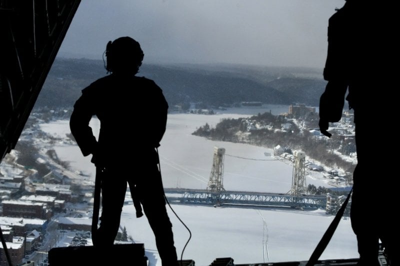 Michigan Tech ROTC student-cadets get an aerial view of the Portage Lake Lift Bridge during a flying exercise in January.