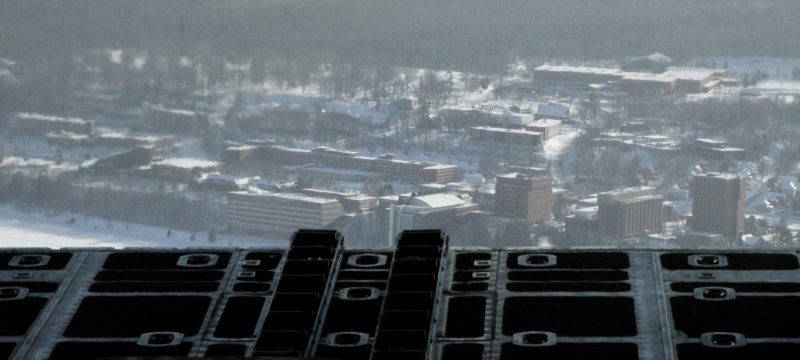 Aerial view of Michigan Tech campus as seen from berth of C-130 airplane.