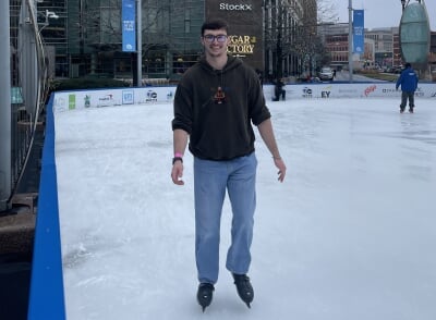 Daron Hebeler on skates on an outdoor rink.