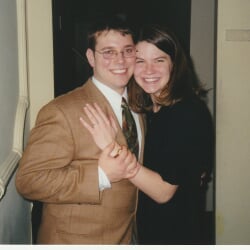 Dannett, wearing an engagement ring, and Jerrywith their arms around each other.