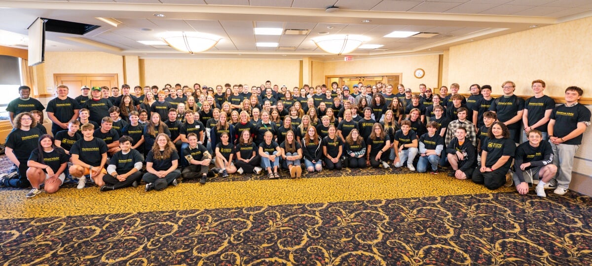 A large group of Thompson Scholars wearing matching shirts.