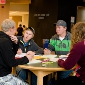 Studnets sitting at a table.