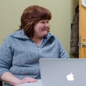 Person sitting at a laptop.