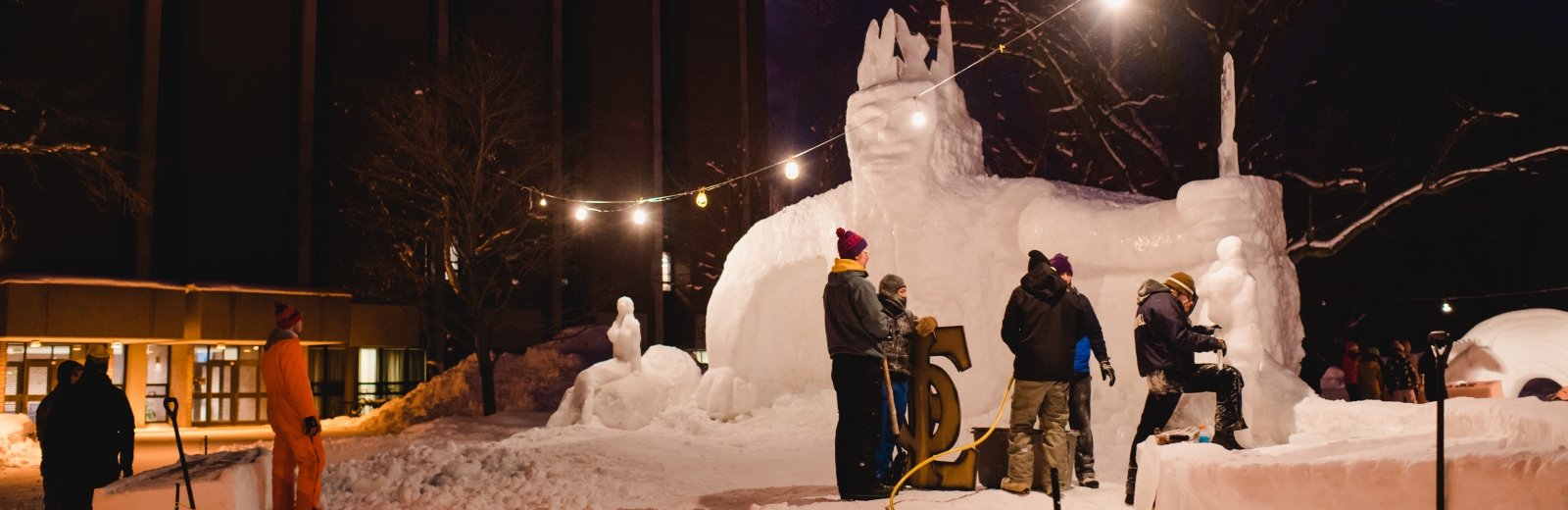 Working in the snow and cold to build the best snow statue is a Tech tradition.