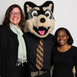 Susan Liebau poses with Blizzard and a student.