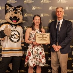 President's Award recipient Emma Coenen poses with Dr. Koubek and Blizzard.