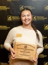 Madison Mattila poses with her award plaque