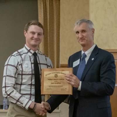 Dr Koubek givng an award