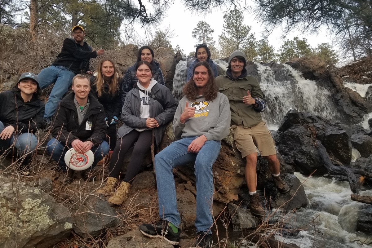 Students on the Arizona trip pose with a waterfall