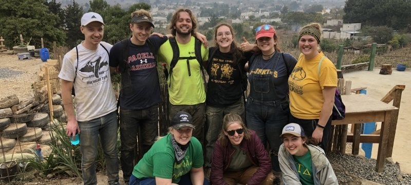 Group of students in front of the tire project.