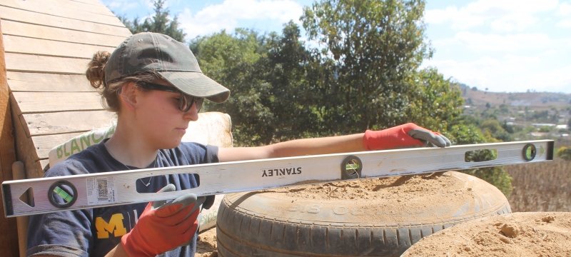 Tate leveling a tire stack.