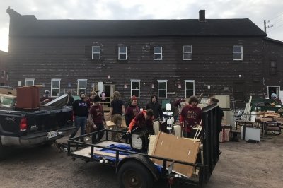 Students haul donations to the new Angel Mission location