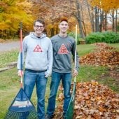 Volunteers pose with rakes at Make a Difference Day