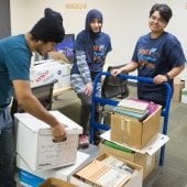 Volunteers stack and organize supplies